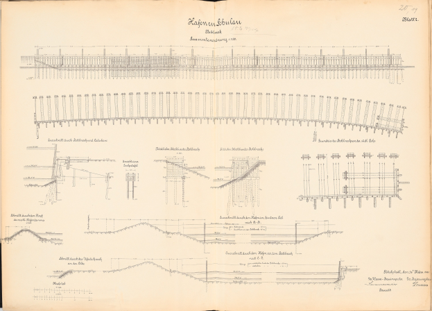 Offenes Buch mit detaillierten Zeichnungen und Text eines Eisenbahnsystems, einschließlich einer Illustration der Bahnstrecke.