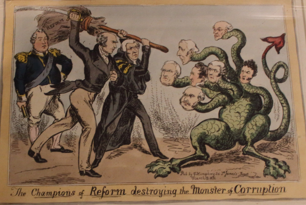 Ein Cartoon auf einem Blatt Papier, das die Champions der Reform gegen ein Monster namens 'Korruption' zeigt, mit dem Text 'Die Champions der Reform zerstören das Monster der Korruption.'